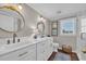 Elegant bathroom featuring double sinks with marble countertops, gold fixtures, and a walk-in shower at 1751 Nichols Hwy., Aynor, SC 29511