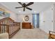 Neutral Bedroom with a wooden crib, dresser, curtains, and closet at 1751 Nichols Hwy., Aynor, SC 29511