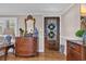 Inviting foyer featuring a wood door, elegant furnishings, hardwood floors, and stylish interior decorations at 1751 Nichols Hwy., Aynor, SC 29511