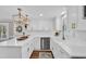 Stylish kitchen with white cabinets, stainless steel dishwasher, and a farmhouse sink at 1751 Nichols Hwy., Aynor, SC 29511