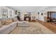 Spacious living room with a cozy seating area, large rug, and entertainment center under recessed lighting at 1751 Nichols Hwy., Aynor, SC 29511