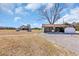 Property showcasing an outbuilding, barn, and ample space, all under a vast sky at 1751 Nichols Hwy., Aynor, SC 29511