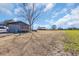 Extensive land with a barn, shed, and lush greenery under a bright sky at 1751 Nichols Hwy., Aynor, SC 29511