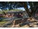 Private backyard featuring a wooden swing, mature trees, and ample space for relaxation at 1916 Jasper St., Georgetown, SC 29440