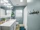 Bathroom featuring vanity with marble top, and blue accent rug and walls at 1916 Jasper St., Georgetown, SC 29440