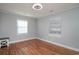 Bedroom with hardwood floors, light gray walls, and two windows at 1916 Jasper St., Georgetown, SC 29440