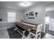 Cozy dining area with rustic table, bench seating, and a neutral color palette at 1916 Jasper St., Georgetown, SC 29440