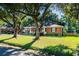 Charming brick home with well-manicured lawn, front porch, and mature trees in a quiet neighborhood at 1916 Jasper St., Georgetown, SC 29440