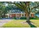 Charming brick ranch home with a well-manicured lawn and a cozy front porch at 1916 Jasper St., Georgetown, SC 29440