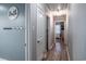 Hallway featuring hardwood floors, neutral paint, and doors leading to various rooms at 1916 Jasper St., Georgetown, SC 29440
