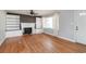 Inviting living room featuring a fireplace with built-in bookshelves and hardwood floors at 1916 Jasper St., Georgetown, SC 29440