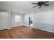 Open-concept living room featuring hardwood floors, a ceiling fan, and plenty of natural light at 1916 Jasper St., Georgetown, SC 29440
