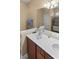 Bright bathroom featuring a double vanity with modern fixtures and an enclosed shower in neutral tones at 195 Cupola Dr., Longs, SC 29568