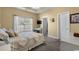 Cozy bedroom with natural light, a comfortable bed, and neutral walls at 195 Cupola Dr., Longs, SC 29568