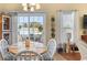 Well-lit dining area with a view of the outdoor patio at 195 Cupola Dr., Longs, SC 29568