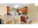The well-lit kitchen offers a breakfast bar with seating, ample cabinet space, and modern appliances at 195 Cupola Dr., Longs, SC 29568