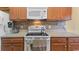 This kitchen features tiled backsplash and countertops with stainless steel appliances at 195 Cupola Dr., Longs, SC 29568
