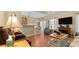 Spacious living room featuring hardwood floors, neutral paint, and fireplace at 195 Cupola Dr., Longs, SC 29568