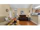 Comfortable living room with hardwood floors, neutral paint, and comfortable furniture at 195 Cupola Dr., Longs, SC 29568