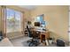 Functional home office featuring a desk, rolling chair, window, and storage shelving at 195 Cupola Dr., Longs, SC 29568
