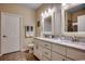 A stylish bathroom showcases a dual-sink vanity with white cabinets and framed mirrors at 196 Rose Water Loop, Myrtle Beach, SC 29588