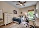 Cozy bedroom featuring a ceiling fan, a plush bed, a neutral color palette, and dedicated desk space at 196 Rose Water Loop, Myrtle Beach, SC 29588
