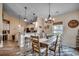 Charming dining area featuring stylish light fixtures, comfortable seating, and an open floor plan at 196 Rose Water Loop, Myrtle Beach, SC 29588