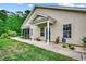 Inviting home entrance featuring a covered porch and a meticulously maintained lawn at 196 Rose Water Loop, Myrtle Beach, SC 29588