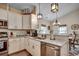 This kitchen boasts stone countertops and stainless steel appliances with an adjacent dining area at 196 Rose Water Loop, Myrtle Beach, SC 29588