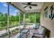 Relaxing screened porch with comfortable seating and views of the private backyard at 196 Rose Water Loop, Myrtle Beach, SC 29588