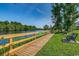 Picturesque community walkway with lake views and seating at 196 Rose Water Loop, Myrtle Beach, SC 29588
