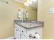 Neat bathroom featuring a vanity with a mirror, a granite countertop, and ample storage space at 200 76Th Ave. N # 410, Myrtle Beach, SC 29572