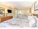 Comfortable bedroom featuring two beds, a dresser, and a TV, perfect for relaxation at 200 76Th Ave. N # 410, Myrtle Beach, SC 29572