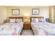 Inviting bedroom featuring two beds with decorative bedding and charming nautical-themed artwork at 200 76Th Ave. N # 410, Myrtle Beach, SC 29572