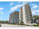 Exterior view of a white high-rise condo complex featuring many balconies at 200 76Th Ave. N # 410, Myrtle Beach, SC 29572