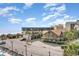 Scenic exterior view of condo buildings, parking lot, and sandy beach near the ocean at 200 76Th Ave. N # 410, Myrtle Beach, SC 29572