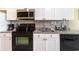 Well-equipped kitchen featuring modern appliances, ample counter space, and stylish backsplash at 200 76Th Ave. N # 410, Myrtle Beach, SC 29572