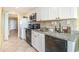 Modern kitchen with granite countertops, stainless steel appliances, and white cabinetry at 200 76Th Ave. N # 410, Myrtle Beach, SC 29572