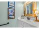 Charming powder room featuring a decorative mirror, stylish vanity, and coastal-themed accents at 209B Woodland Dr., Murrells Inlet, SC 29576