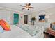 Comfortable bedroom with a large bed, white dresser, and light blue decor, with pops of color and bright lighting at 209B Woodland Dr., Murrells Inlet, SC 29576