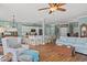 Open-concept living space featuring hardwood floors, neutral decor, and a seamless flow to the kitchen at 209B Woodland Dr., Murrells Inlet, SC 29576