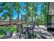 Charming backyard patio with outdoor seating, a grill, and views of the landscaped backyard and fence at 2131 Timmerman Rd., Myrtle Beach, SC 29588