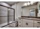 Bathroom features gray tile, glass shower, and white cabinets with granite countertop at 2131 Timmerman Rd., Myrtle Beach, SC 29588