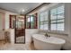 Elegant bathroom with a freestanding tub, walk-in shower, and modern fixtures at 2131 Timmerman Rd., Myrtle Beach, SC 29588