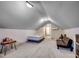 Attic bonus room with a sloped ceiling features a bed, couch, and carpet at 2131 Timmerman Rd., Myrtle Beach, SC 29588