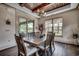 Elegant dining room with rustic wooden table and access to an outdoor patio at 2131 Timmerman Rd., Myrtle Beach, SC 29588