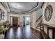 Inviting foyer with hardwood floors, tray ceilings, and an elegant staircase at 2131 Timmerman Rd., Myrtle Beach, SC 29588