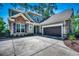 Charming home with a stone-accented facade, a two-car garage, and a spacious driveway at 2131 Timmerman Rd., Myrtle Beach, SC 29588