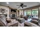 Beautiful living room with stone fireplace, ceiling fan, and access to an outdoor patio at 2131 Timmerman Rd., Myrtle Beach, SC 29588