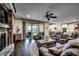 Cozy living room featuring a stone fireplace, leather seating, and a sliding glass door at 2131 Timmerman Rd., Myrtle Beach, SC 29588
